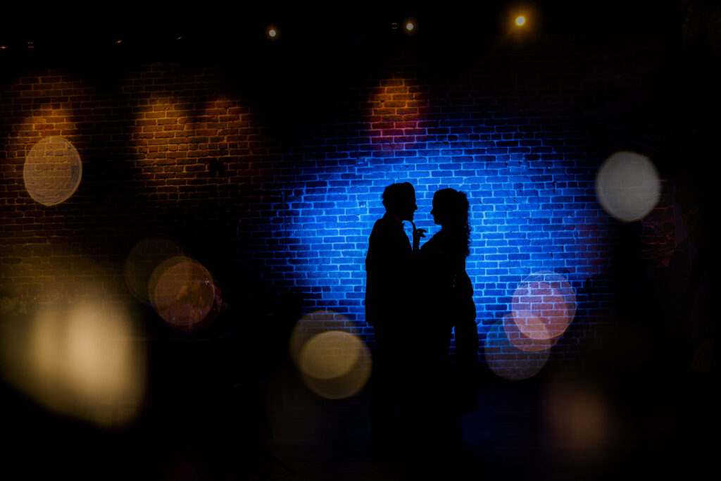 Silhouette of a couple against deep blue light